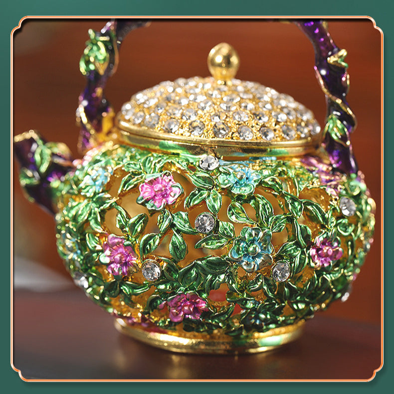 Close-up of flower and leaf details on enamel teapot box