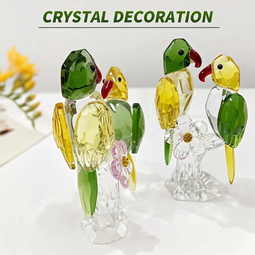 Green and yellow glass parrot pair ornaments on clear branch-style bases
