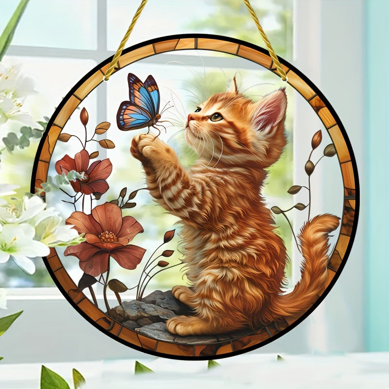 Orange cat acrylic hanging ornament beside white flowers