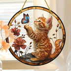 Cat and butterfly hanging ornament near peach flowers
