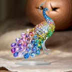 Rainbow peacock acrylic ornament styled near a potted plant