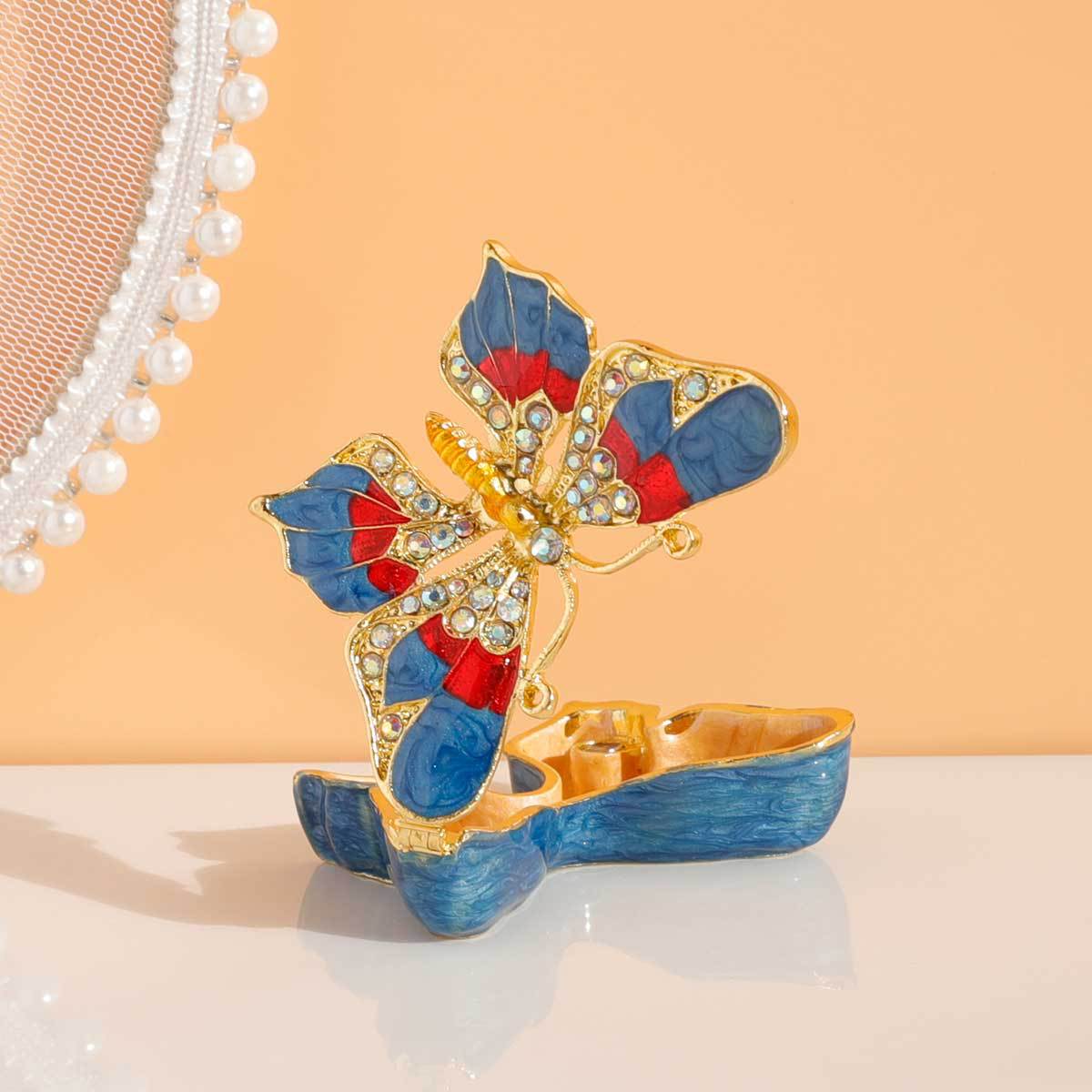 Butterfly jewelry box shown open with gold-toned interior