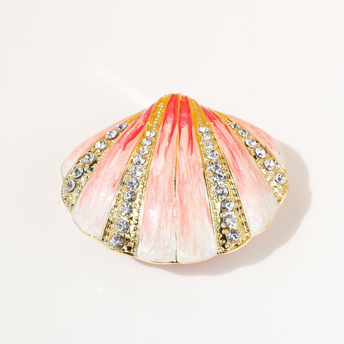 Pink shell jewelry box against a white background