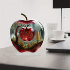 Apple-shaped acrylic ornament styled on an office desk