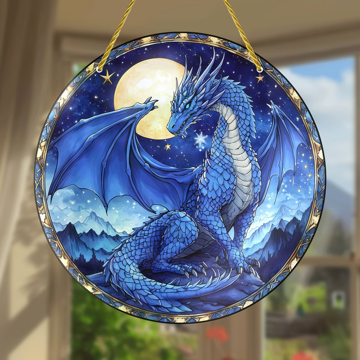Stardrake dragon ornament hanging beside an indoor window