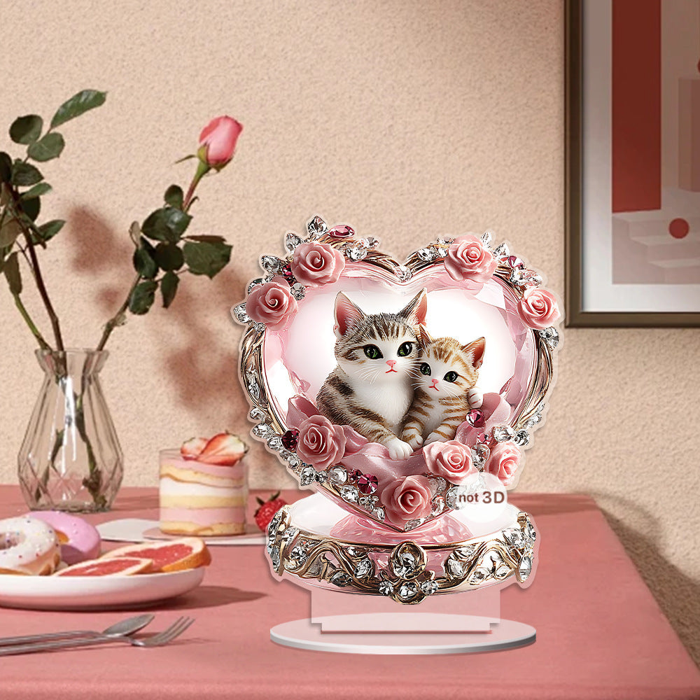 Pink heart cat couple acrylic ornament beside a rose and desserts