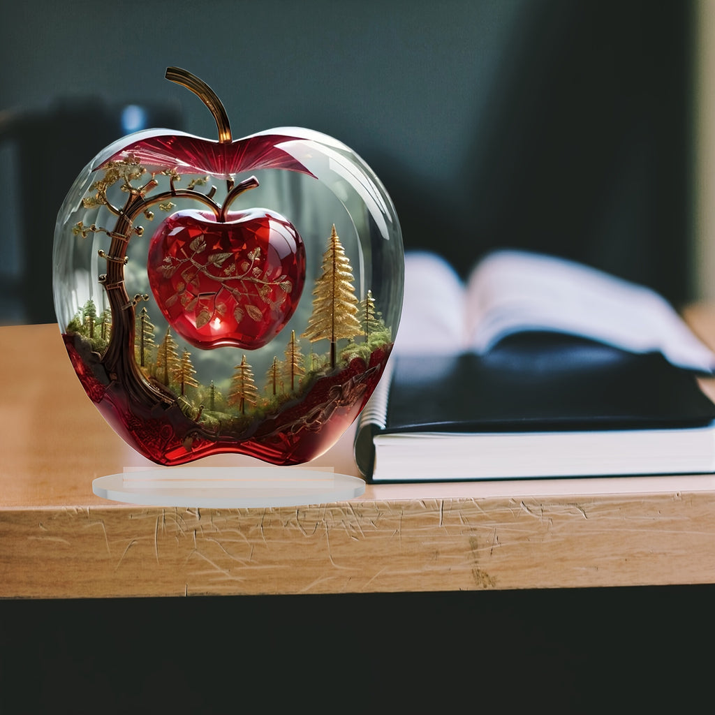 Forest apple tabletop ornament beside an open book