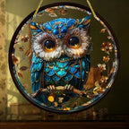 Owl and floral artwork on a round hanging ornament