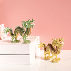Green and golden dragon figurines displayed together