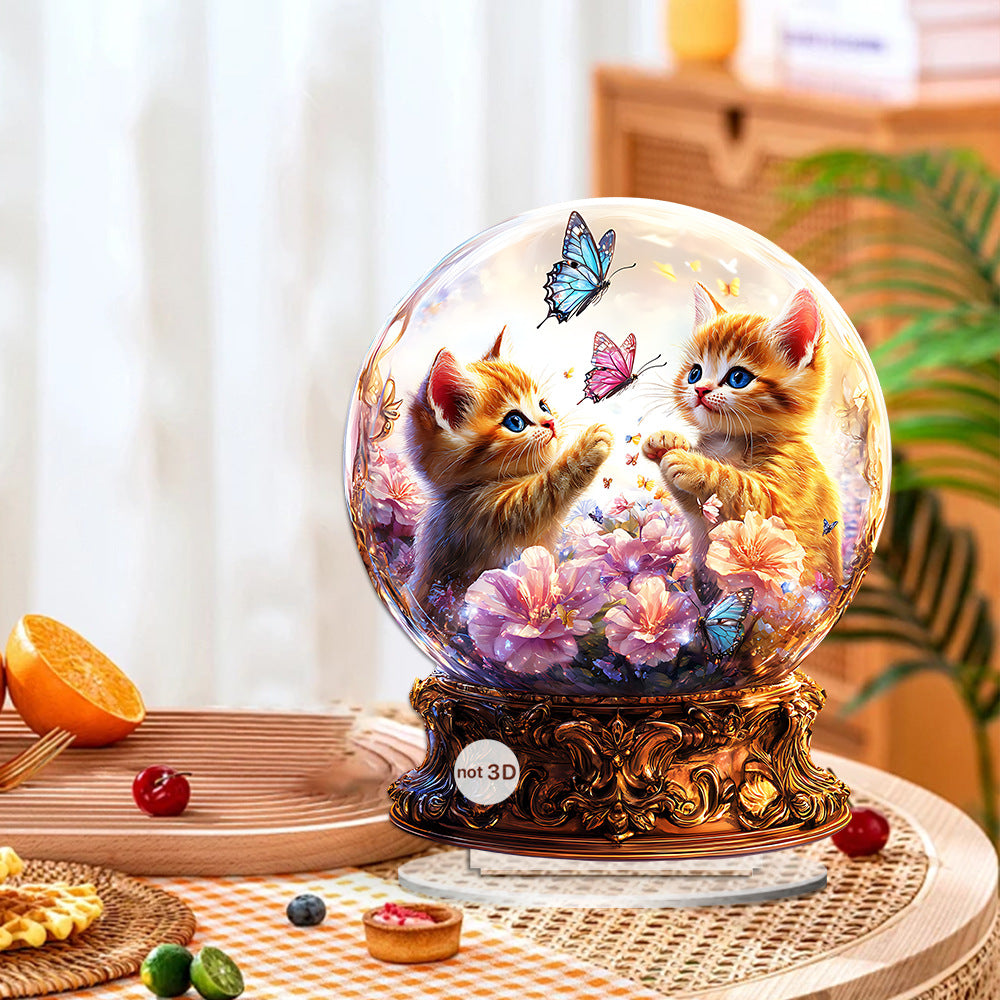 Orange cat and butterfly acrylic ornament in a bright kitchen setting