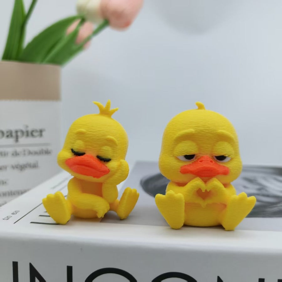 A cute playful and fun little heart-shaped duck figurine perfect for home decor
