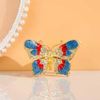 Butterfly jewelry box displayed upright on a reflective surface