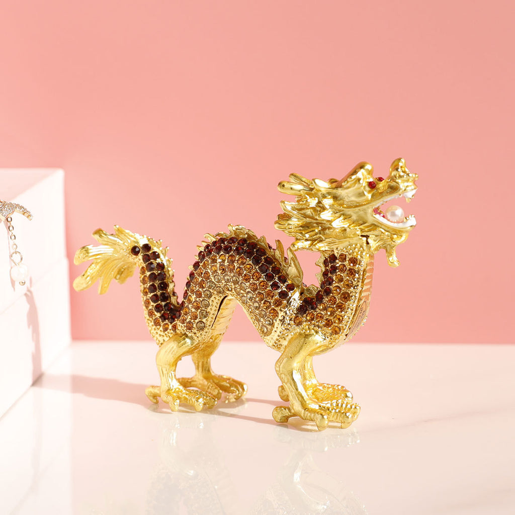Golden dragon figurine with dark decorative accents