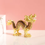 Golden dragon figurine with dark decorative accents