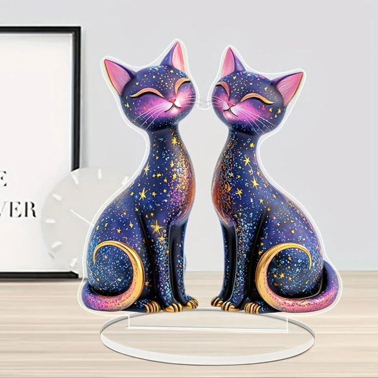 Lumi moon-and-star twin-cat artwork displayed on a table