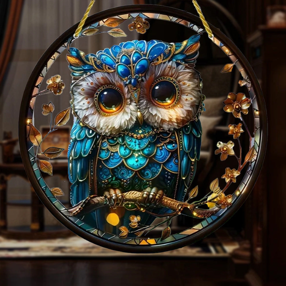 Blue and gold owl hanging ornament with branch details