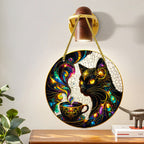 MoonCat round cat ornament hanging on a wall above a table