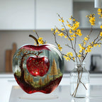 Apple-shaped forest artwork on a flat acrylic tabletop ornament