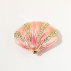Top view of pink shell-shaped jewelry box