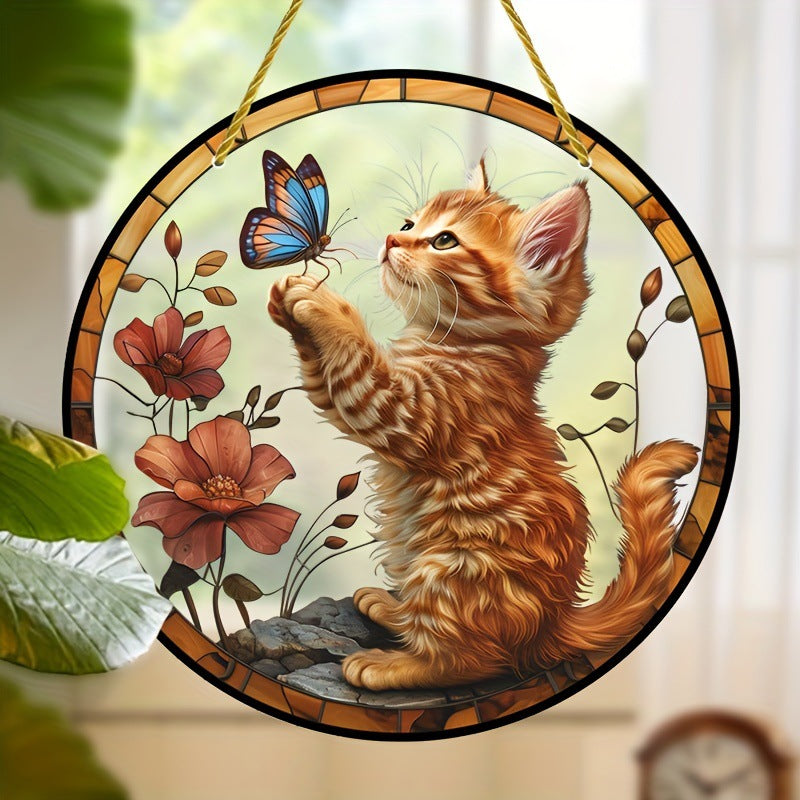 Cat and butterfly round ornament near green leaves