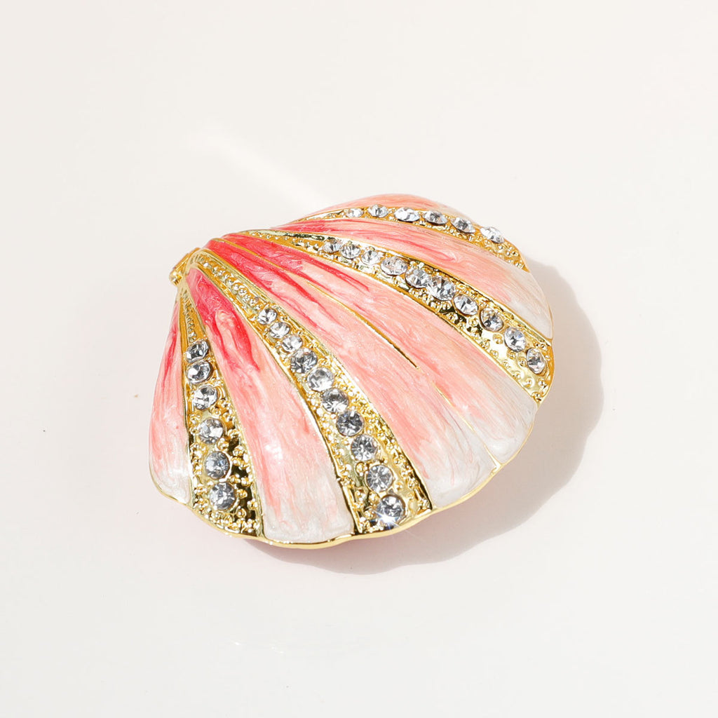 Angled view of pink shell-shaped jewelry box