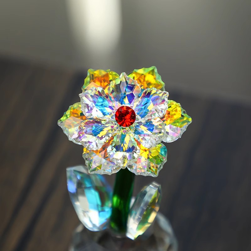 Front view of sunflower ornament with red center and green stem