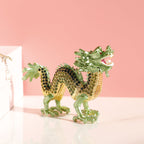 Green dragon figurine with raised head and curved body