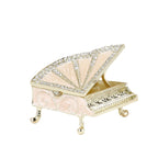 Pink piano jewelry box against a white background
