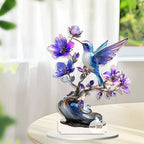 Blue and purple hummingbird acrylic ornament on a tabletop