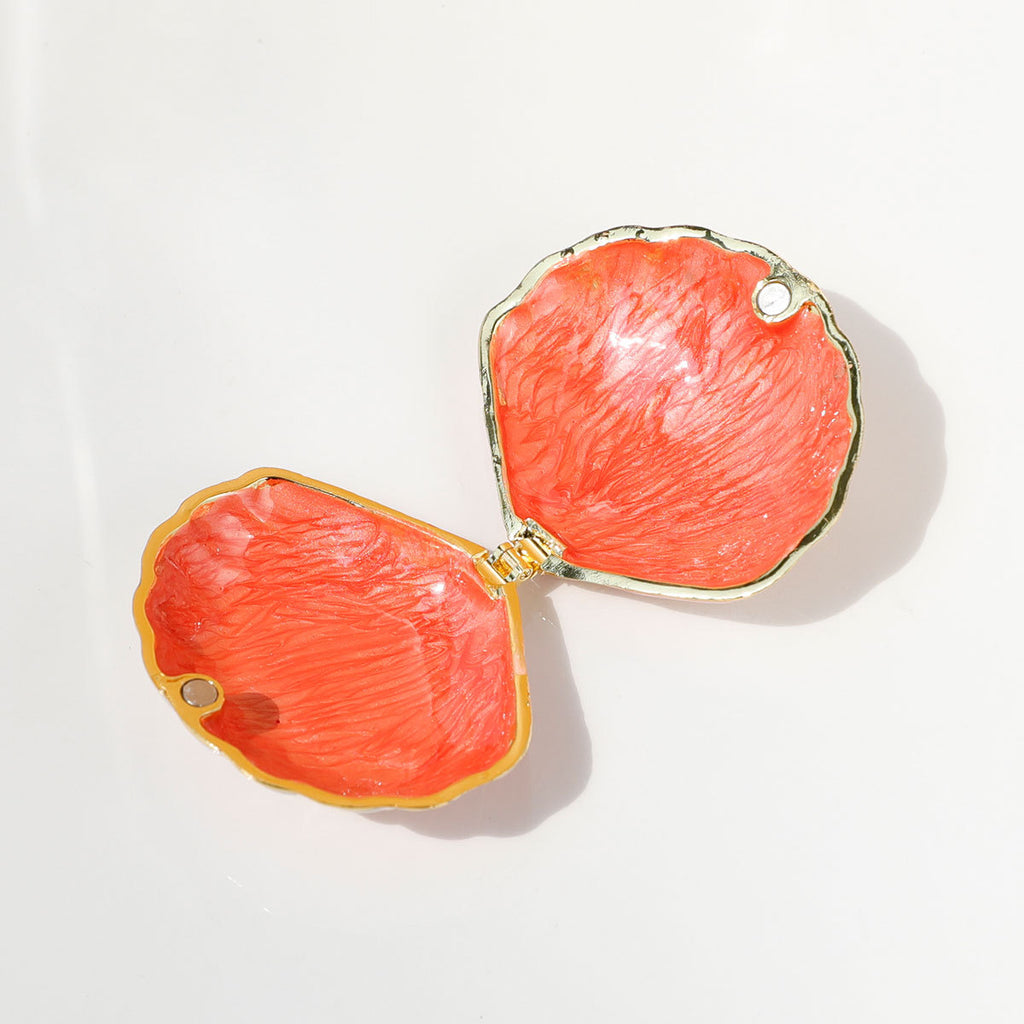 Pink shell jewelry box shown open