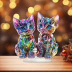 Lumi twin-cat acrylic stand against warm festive lights