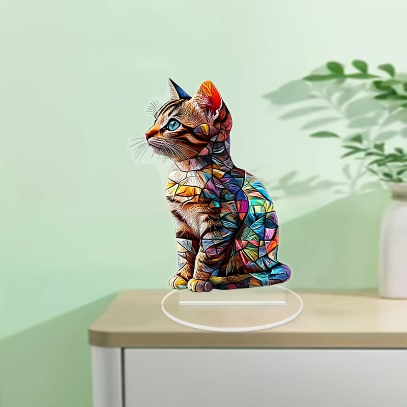 Colorful cat acrylic tabletop ornament against a pale green background
