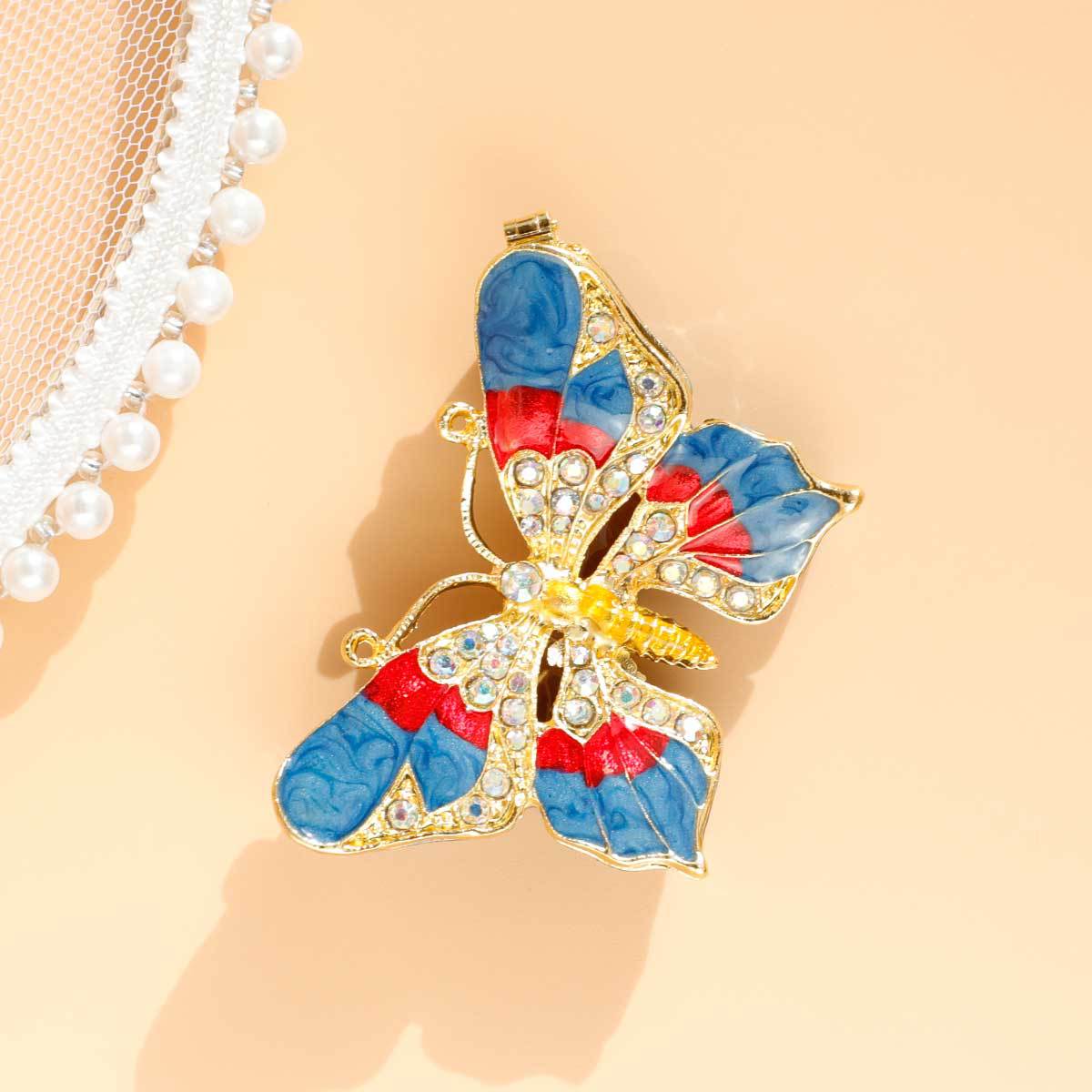 Angled overhead view of butterfly-shaped jewelry box