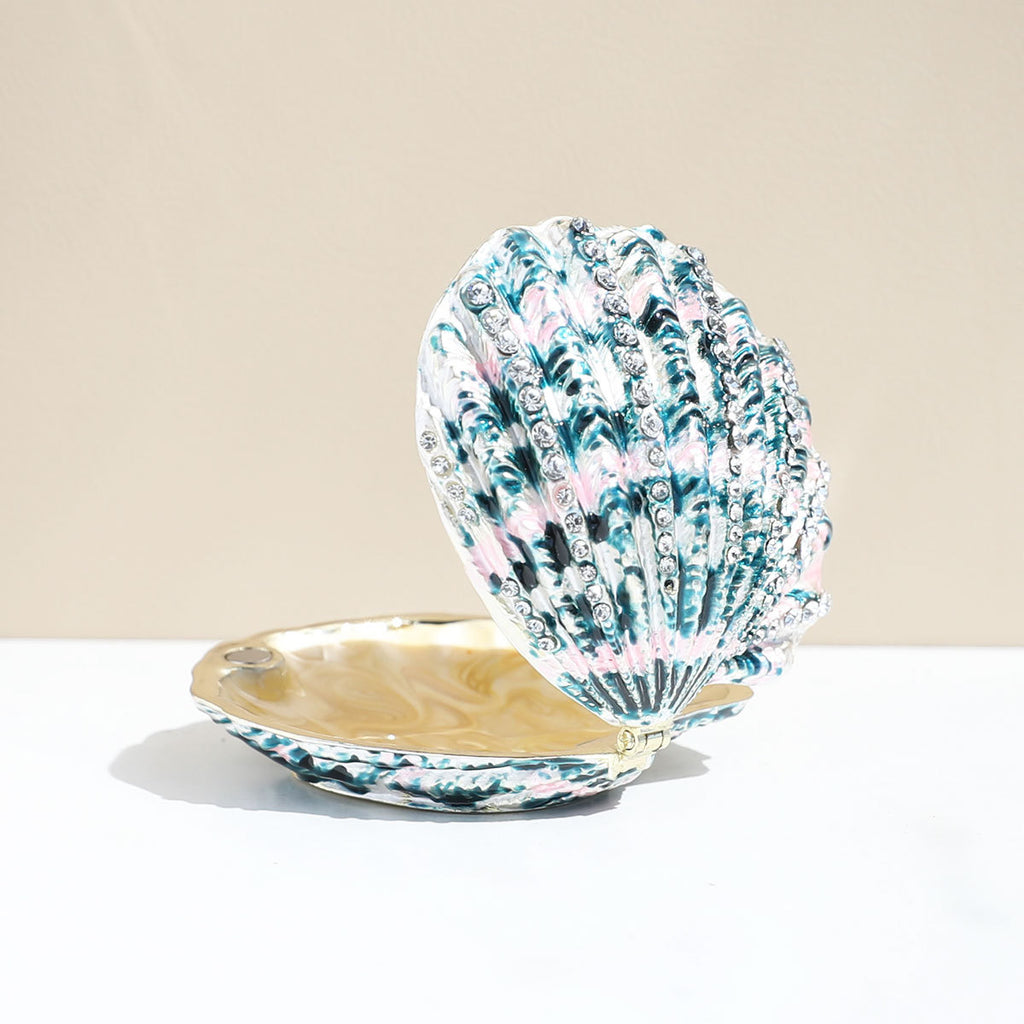 Green shell-shaped enamel jewelry box shown open